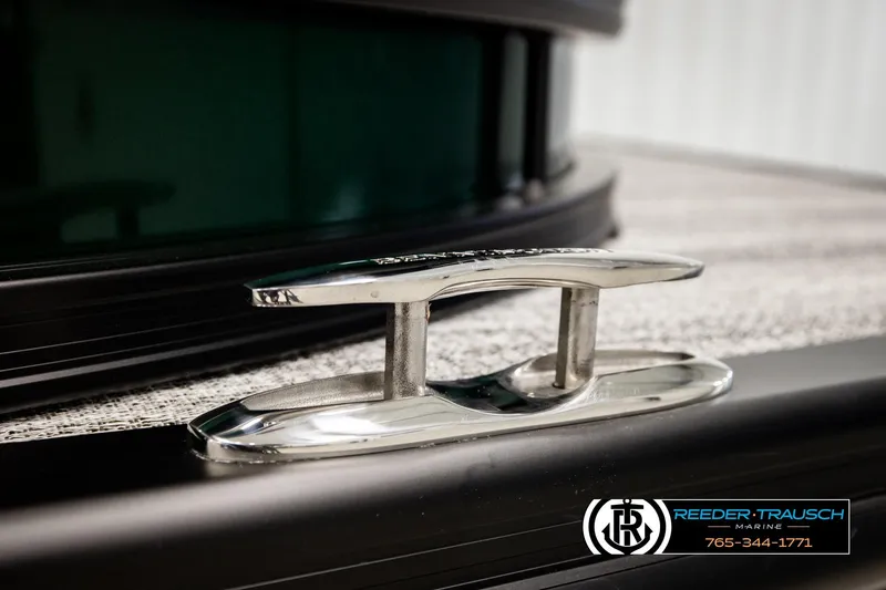 Slide: The Image of Chrome cleat on 2026 Bennington MOFBSF boat deck, Reeder-Trausch Marine logo visible. - 49