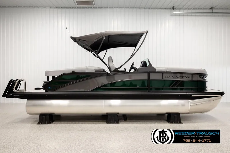 Slide: The Image of 2026 Bennington MOFBSF pontoon boat with canopy in showroom. - 5