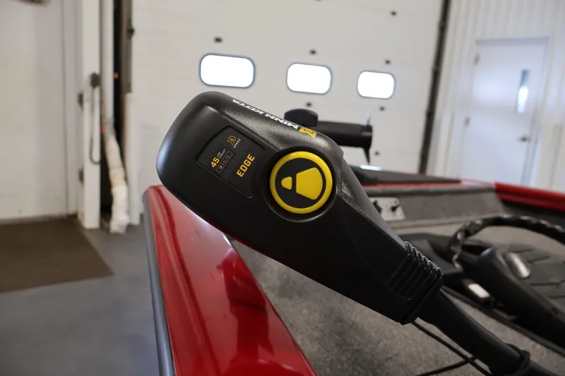 Slide: The Image of Close-up of 2024 Tracker Pro Team 175 TXW boat control panel indoors. - 11