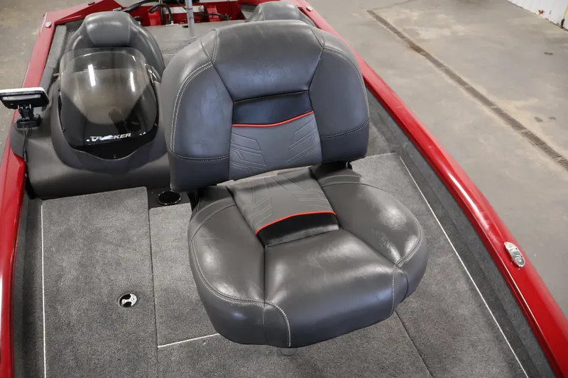 Slide: The Image of 2024 Tracker Pro Team 175 TXW boat interior with gray seating and red accents. - 13