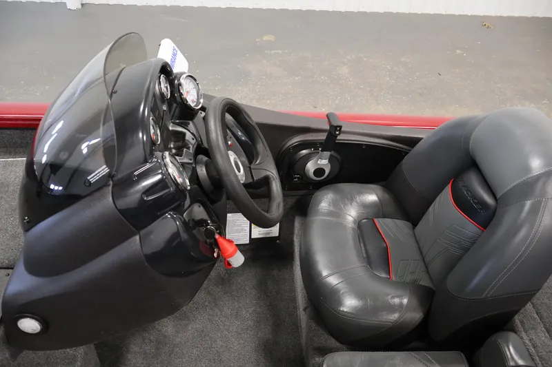 Slide: The Image of 2024 Tracker Pro Team 175 TXW boat interior with steering wheel and seats. - 16