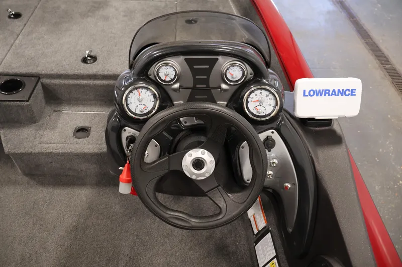Slide: The Image of 2024 Tracker Pro Team 175 TXW boat dashboard with steering wheel and Lowrance display. - 17