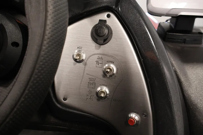 Slide: The Image of 2024 Tracker Pro Team 175 TXW dashboard with switches and 12V outlet. - 22