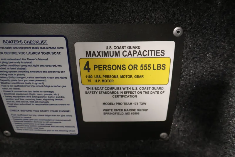 Slide: The Image of 2024 Tracker Pro Team 175 TXW capacity label, 4 persons or 555 lbs, U.S. Coast Guard compliant. - 23