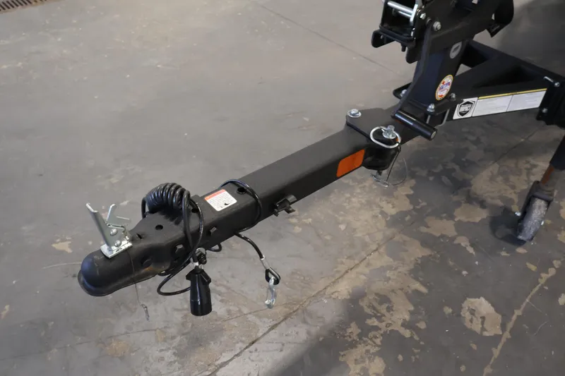 Slide: The Image of 2024 Tracker Pro Team 175 TXW trailer hitch on concrete floor. - 32