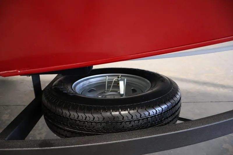 Slide: The Image of 2024 Tracker Pro Team 175 TXW trailer with spare tire underneath. - 33