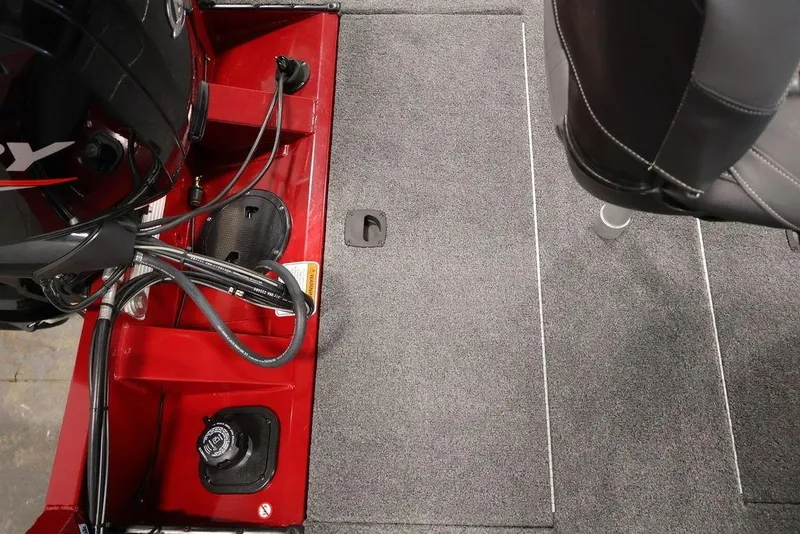 Slide: The Image of 2024 Tracker Pro Team 175 TXW boat interior with motor and seating. - 38