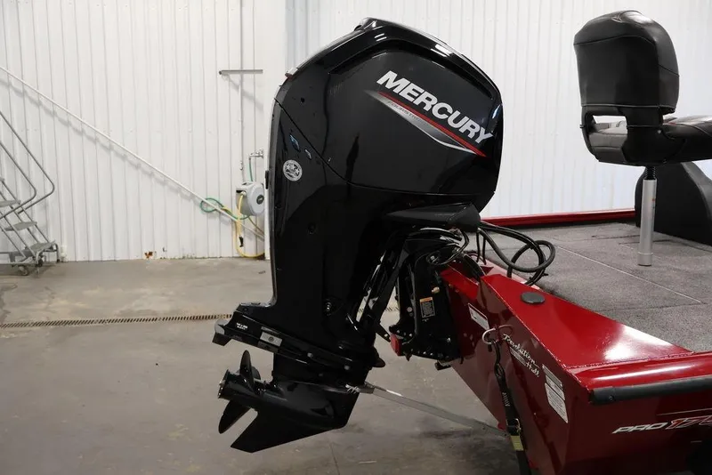Slide: The Image of 2024 Tracker Pro Team 175 TXW with Mercury outboard motor in a garage setting. - 39