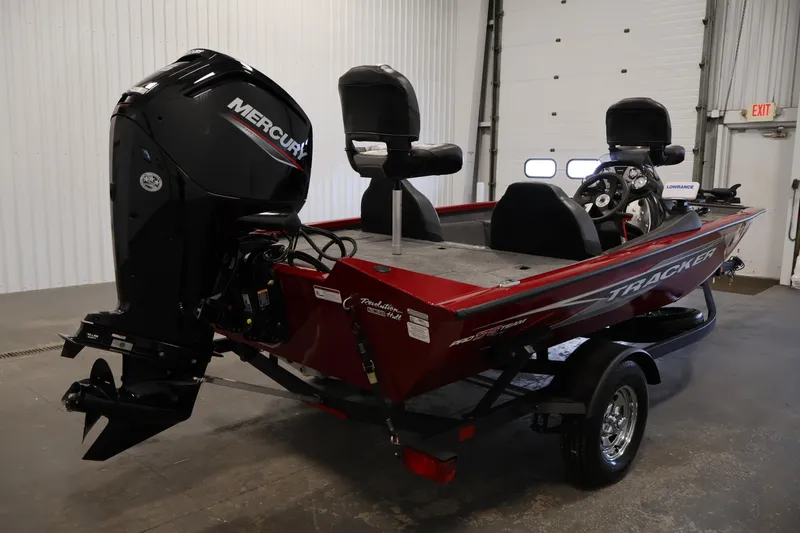 Slide: The Image of 2024 Tracker Pro Team 175 TXW boat with Mercury engine in a garage setting. - 4