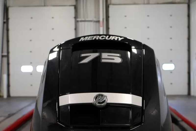 Slide: The Image of 2024 Tracker Pro Team 175 TXW with Mercury 75 engine in a garage setting. - 40