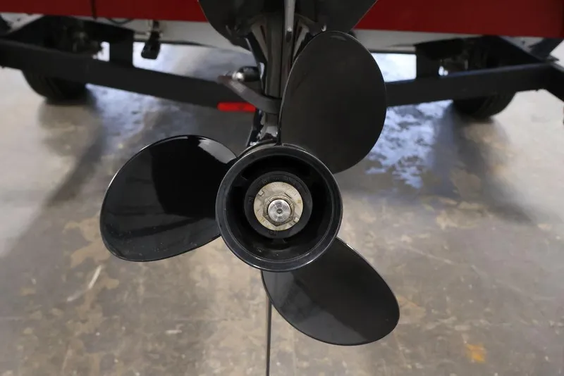 Slide: The Image of 2024 Tracker Pro Team 175 TXW boat propeller close-up in a garage setting. - 42