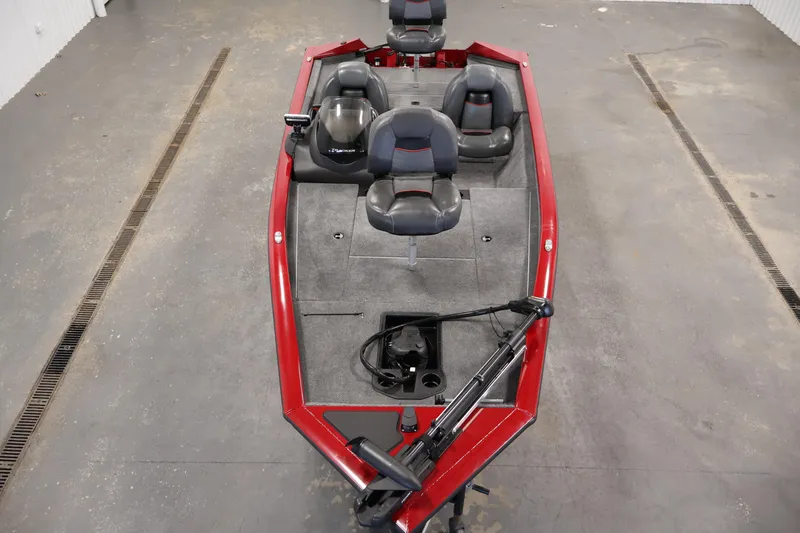 Slide: The Image of 2024 Tracker Pro Team 175 TXW boat with red exterior and gray interior, featuring seating and equipment. - 8