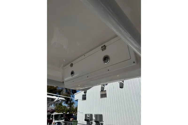 Slide: The Image of 2022 Sea Fox 248 Commander boat storage compartment with lock, viewed from below. - 12