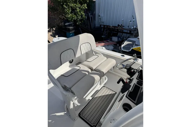 Slide: The Image of 2022 Sea Fox 248 Commander boat interior with dual seats and steering wheel. - 13