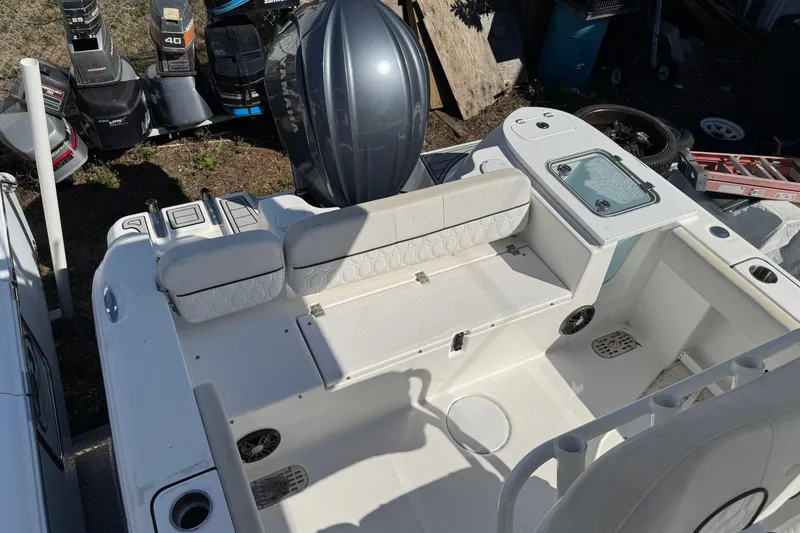 Slide: The Image of 2022 Sea Fox 248 Commander boat interior with seating and engine view. - 17