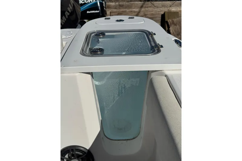 Slide: The Image of 2022 Sea Fox 248 Commander boat livewell with clear lid and water droplets. - 18