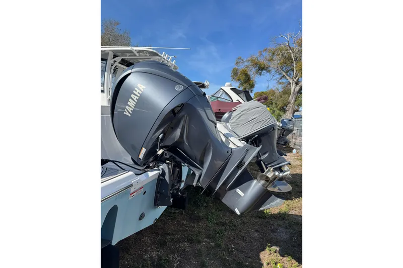 Slide: The Image of 2022 Sea Fox 248 Commander with Yamaha outboard engine, parked outdoors. - 21