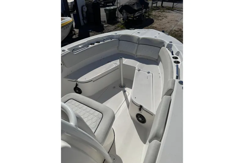 Slide: The Image of 2022 Sea Fox 248 Commander boat interior with cushioned seating and storage compartments. - 4