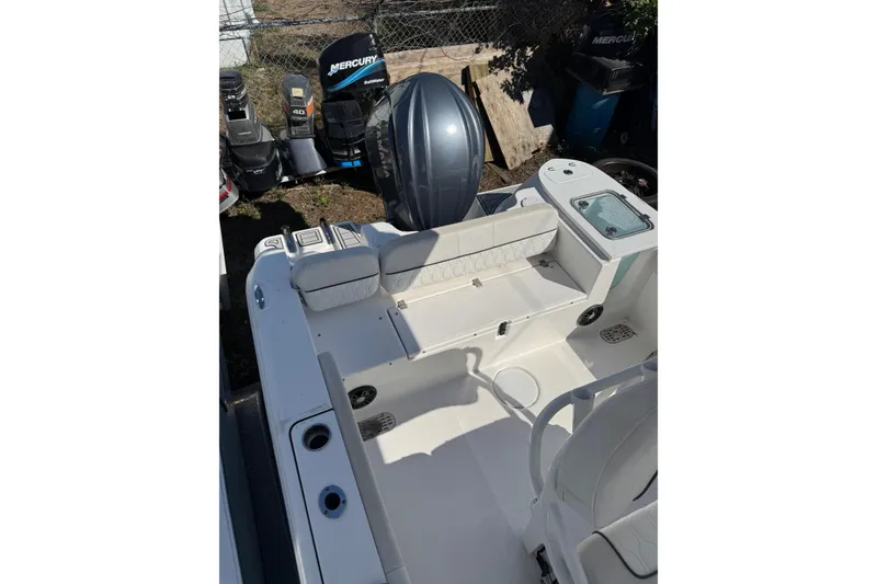 Slide: The Image of 2022 Sea Fox 248 Commander boat interior with seating and outboard motor. - 8