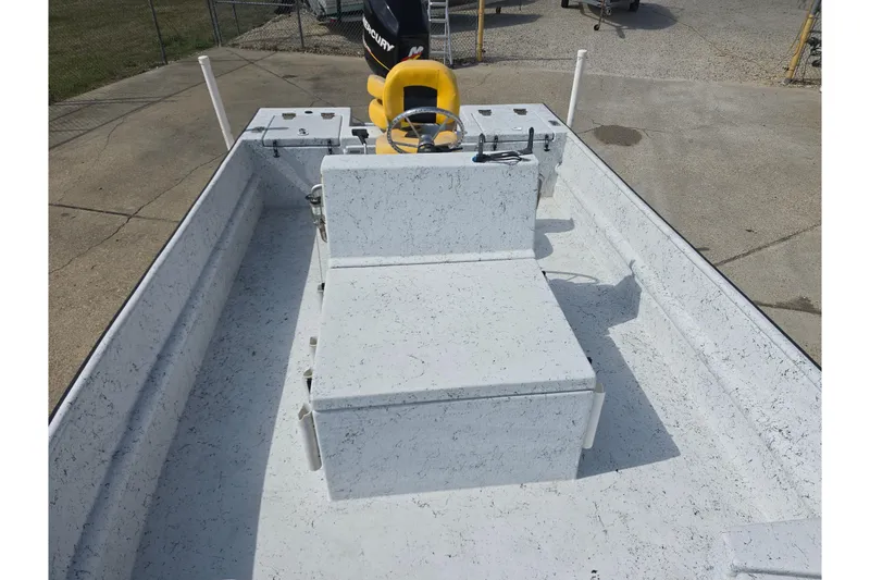 Slide: The Image of 2011 Reno Skiff 22 boat interior with steering console and seating. - 10