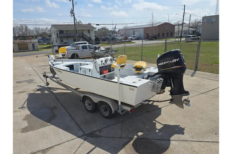 Slide: The Image of 2011 Reno Skiff 22 boat on trailer with Mercury outboard motor. - 5