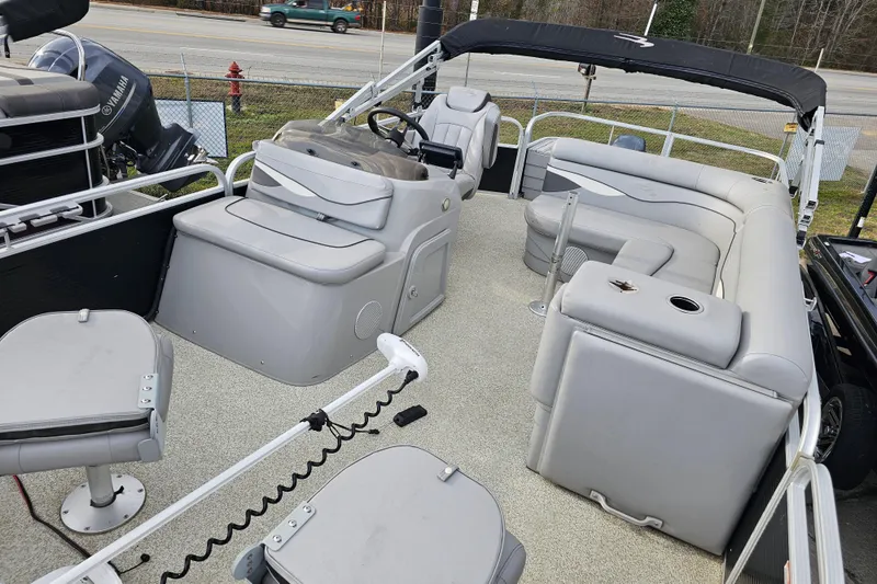 Slide: The Image of 2020 Bennington SV 20 SFV pontoon boat interior with gray seating and steering console. - 14