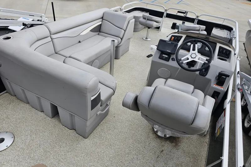 Slide: The Image of 2020 Bennington SV 20 SFV pontoon boat interior with gray seating and steering console. - 6