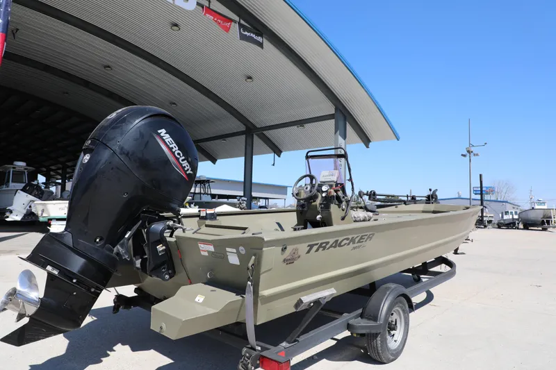 Slide: The Image of 2021 Tracker Grizzly 2072 SC All-Welded boat with Mercury engine on trailer. - 4