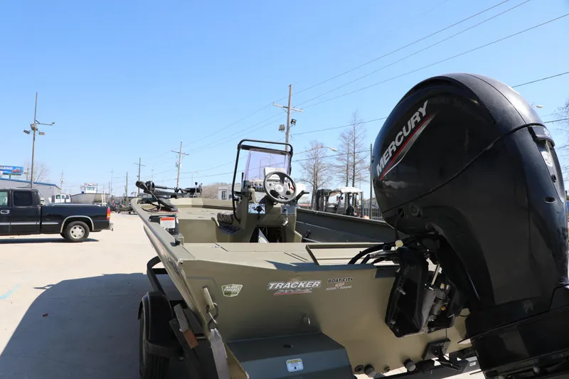 Slide: The Image of 2021 Tracker Grizzly 2072 SC boat with Mercury engine in outdoor setting. - 5