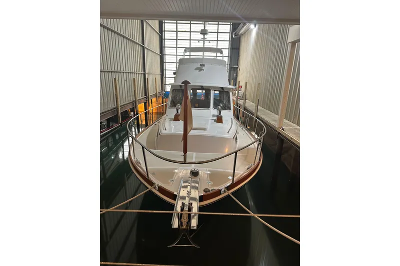 The Image of 2000 Grand Banks 43 Eastbay FB yacht docked in an indoor marina. - 0