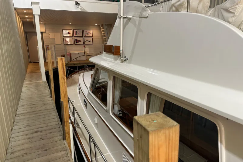 Slide: The Image of 2000 Grand Banks 43 Eastbay FB yacht docked in an indoor marina. - 1