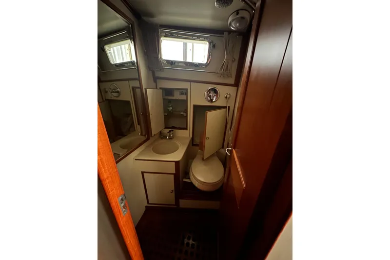 Slide: The Image of 2000 Grand Banks 43 Eastbay FB yacht docked in a covered marina. - 10