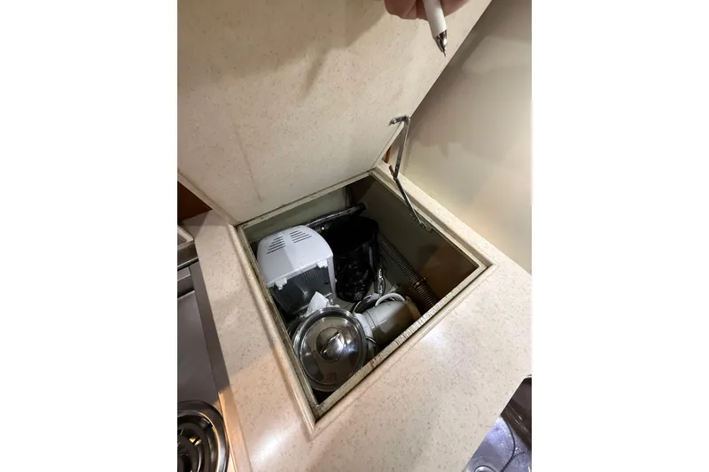 Slide: The Image of Storage compartment on 2000 Grand Banks 43 Eastbay FB yacht with kitchen appliances. - 102