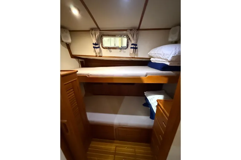Slide: The Image of Cozy cabin with bunk beds in 2000 Grand Banks 43 Eastbay FB yacht. - 107