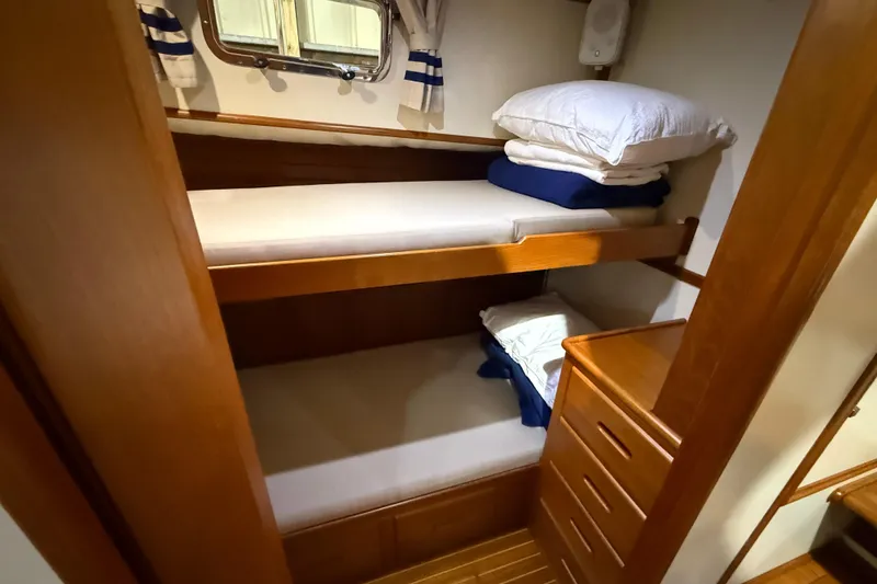 Slide: The Image of Bunk beds in 2000 Grand Banks 43 Eastbay FB cabin with wooden interior. - 108