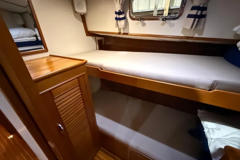 Slide: The Image of Cozy cabin with bunk beds on 2000 Grand Banks 43 Eastbay FB yacht. - 109