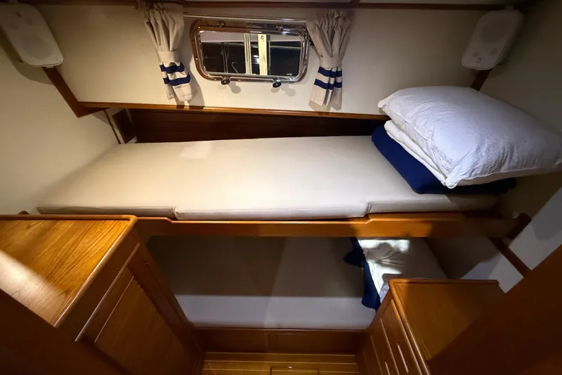 Slide: The Image of Cozy cabin with bunk beds in 2000 Grand Banks 43 Eastbay FB yacht. - 110