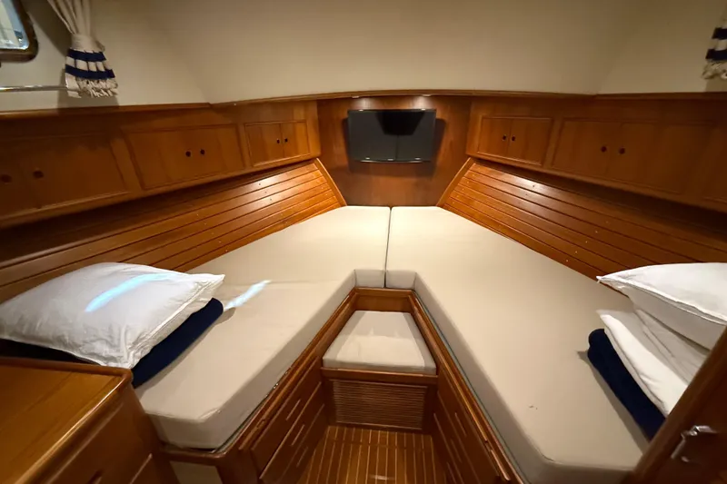 Slide: The Image of Luxurious cabin interior of 2000 Grand Banks 43 Eastbay FB yacht with cozy bedding. - 116
