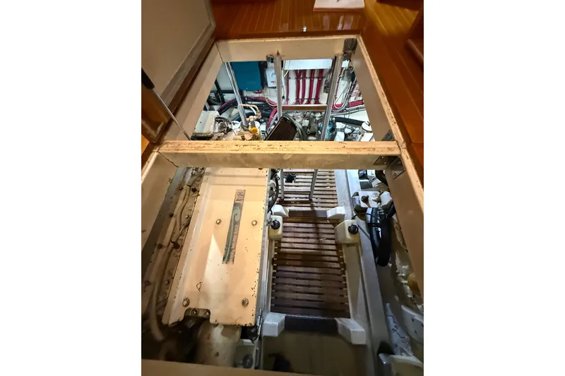 Slide: The Image of Engine room of 2000 Grand Banks 43 Eastbay FB yacht, showcasing mechanical components. - 125