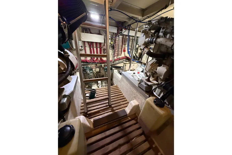 Slide: The Image of Engine room of 2000 Grand Banks 43 Eastbay FB with visible machinery and equipment. - 126