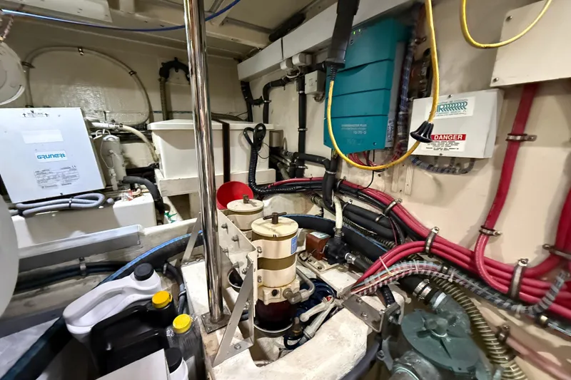 Slide: The Image of Engine room of 2000 Grand Banks 43 Eastbay FB with wiring and equipment. - 128