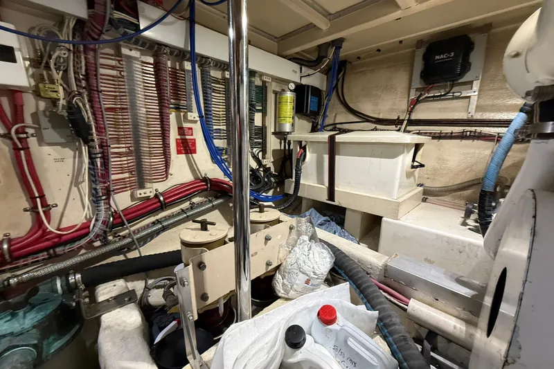 Slide: The Image of Engine room of 2000 Grand Banks 43 Eastbay FB with wiring and equipment. - 129