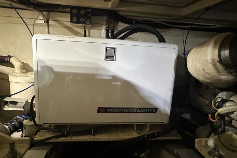 Slide: The Image of 2000 Grand Banks 43 Eastbay FB yacht in indoor storage, showcasing sleek design and craftsmanship. - 13