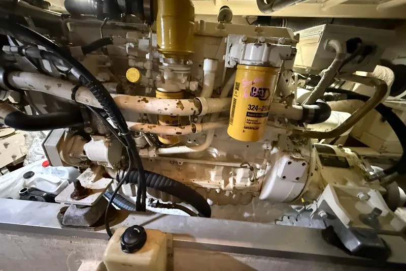 Slide: The Image of Engine room of 2000 Grand Banks 43 Eastbay FB, featuring Caterpillar components. - 134