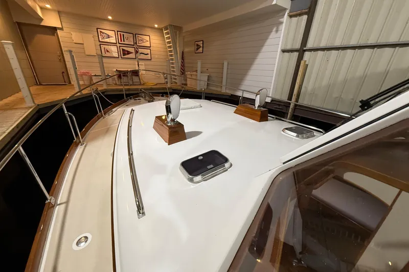 Slide: The Image of 2000 Grand Banks 43 Eastbay FB yacht deck in a marina setting. - 15