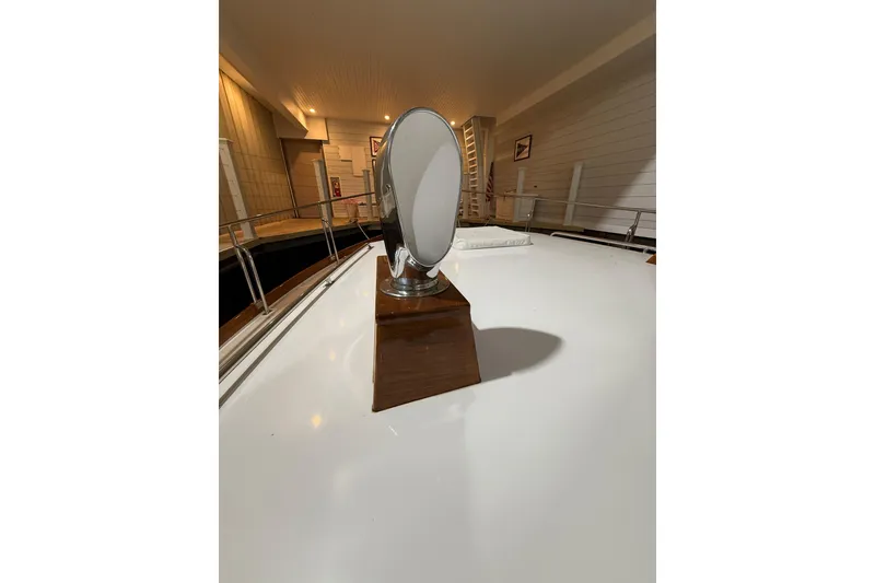 Slide: The Image of Grand Banks 43 Eastbay FB 2000 boat deck with a spotlight in a marina. - 17