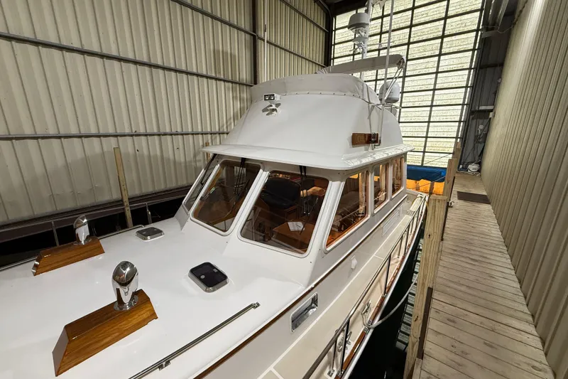 Slide: The Image of 2000 Grand Banks 43 Eastbay FB yacht docked in a covered marina. - 20