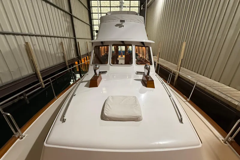Slide: The Image of 2000 Grand Banks 43 Eastbay FB yacht in indoor storage, showcasing sleek design and craftsmanship. - 23