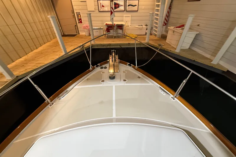 Slide: The Image of Bow view of 2000 Grand Banks 43 Eastbay FB docked indoors. - 28
