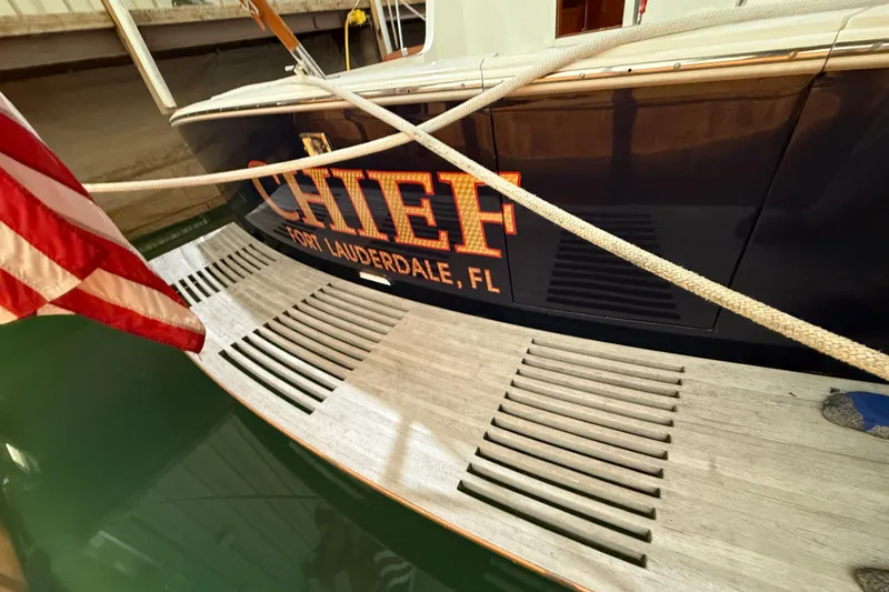 Slide: The Image of Grand Banks 43 Eastbay FB yacht, docked with Fort Lauderdale, FL lettering and American flag. - 33